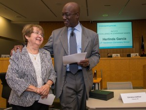 Interim Superintendent Ken Huewitt presents Herlinda Garcia, left, with a leadership award during a Professional Leadership Series meeting, April 6, 2016.