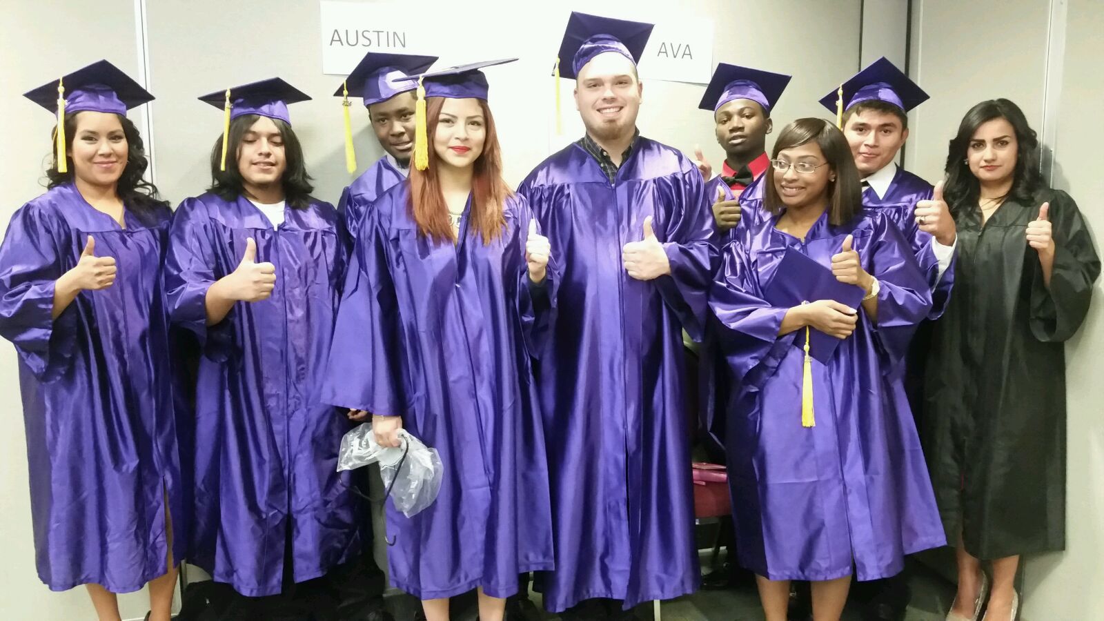 High school students receive diplomas at fall semester graduation