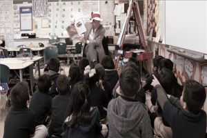 Neil Bush with the Barbara Bush Houston Literacy Foundation reads to a class at Walnut Bend ES