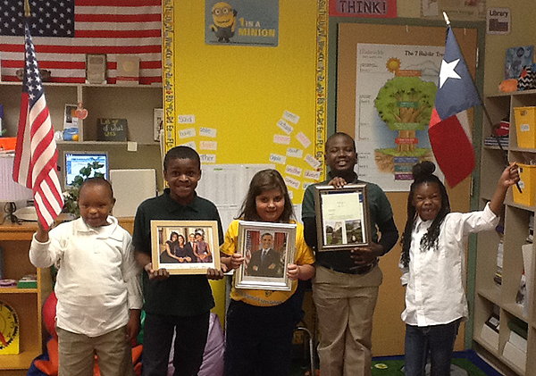 Thompson ES students display some of the items they received from President Barack Obama.