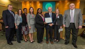 Dr. George Wilding, Vice Provost, Clinical & Interdisciplinary Research MD Anderson; from left,  Angela Borzon, HISD Director of Instructional Technology; Felicia Ceaser-White, HISD Manager of Health and Physical Education; Maureen Cagley, Vice President, Academic Operations MD Anderson (and HISD graduate and HISD parent); Dr. Grenita Lathan, HISD Chief Academic Officer; Dr. Dmitrovsky, Provost and Executive Vice President MD Anderson; Annie Wolfe, HISD Officer of Secondary Curriculum and Development; Dr. Alex Prokhorov, Professor, Behavioral Science; pose for a photograph after announcing a partnership during a Houston ISD Board of Trustee meeting, October 13, 2016.